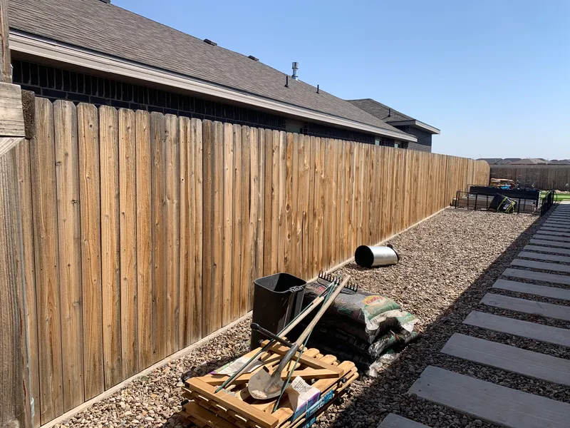 Custom wood fence built by E and J General Construction